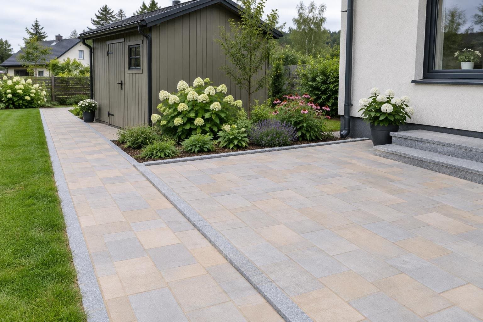 Heleda sillutisega terrass ja kõnnitee äärekiviga